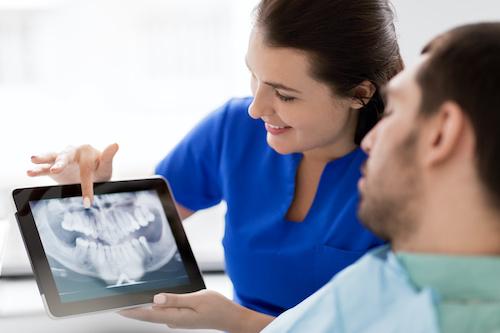 Dental Assistant Showing X Ray Result
