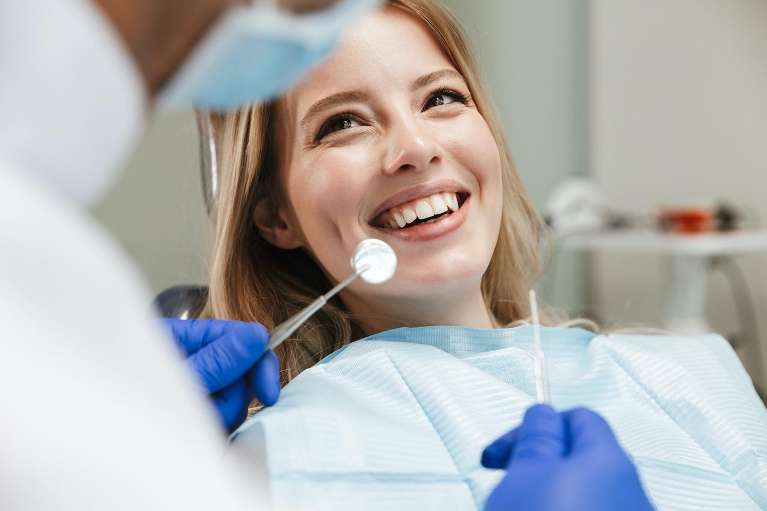 woman getting dental cleaning