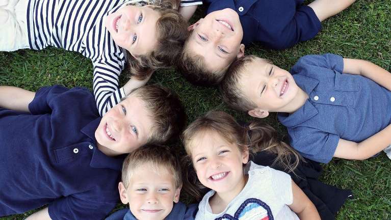 kids in the ground smiling