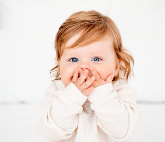 Portrait,Of,A,Surprised,Baby,With,Red,Hair,And,Blue